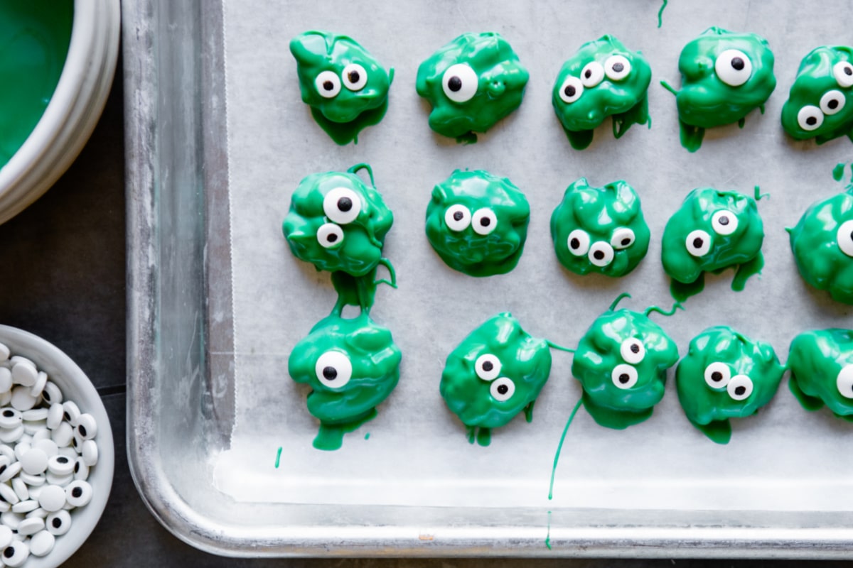 Walnuts dipped in candy coating to look like zombies.