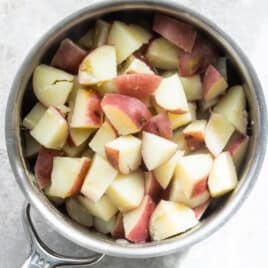 Boiled potatoes in a silver saucepan.