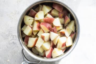 Boiled potatoes in a silver saucepan.