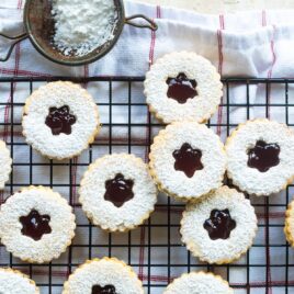 Linzer cookies on a cooling rack.