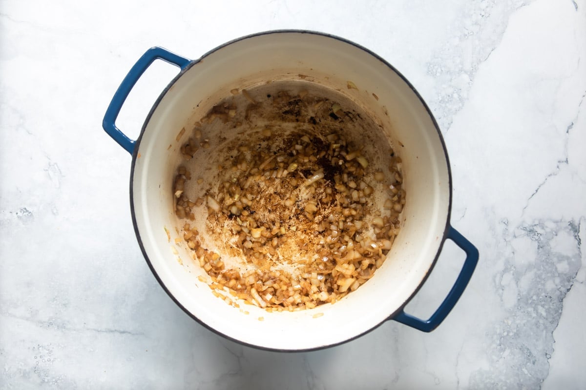 Cooking onions in a dutch oven.