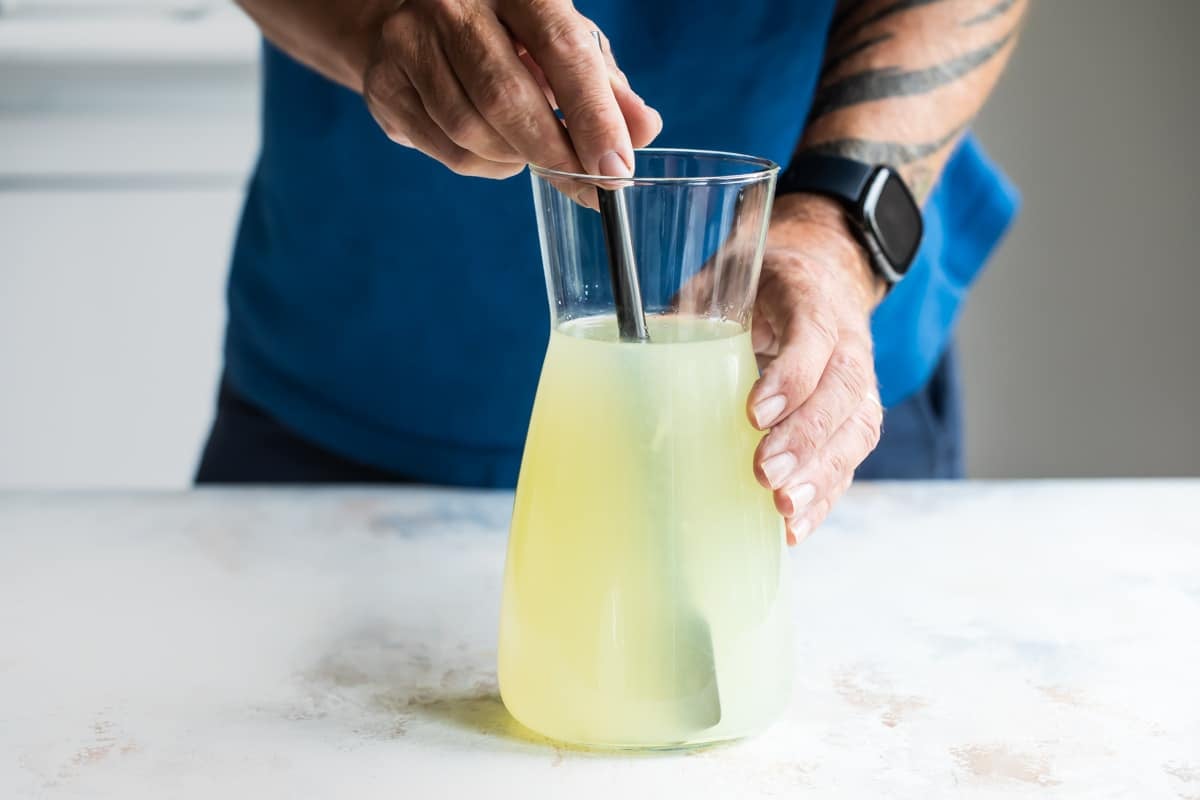 Mixing a pitcher of Virgin margaritas.