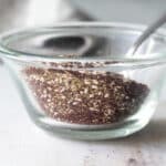 Za'atar seasoning in a clear glass bowl.