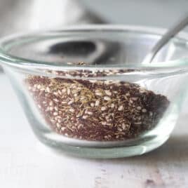 Za'atar seasoning in a clear glass bowl.
