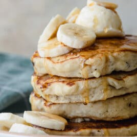 A stack of banana pancakes on a plate.