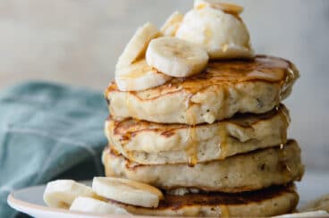 A stack of banana pancakes on a plate.