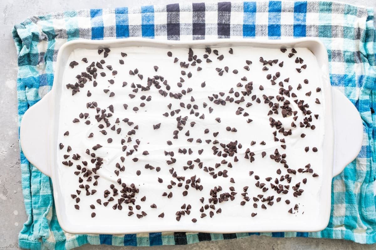 Chocolate lasagna in a white baking dish.