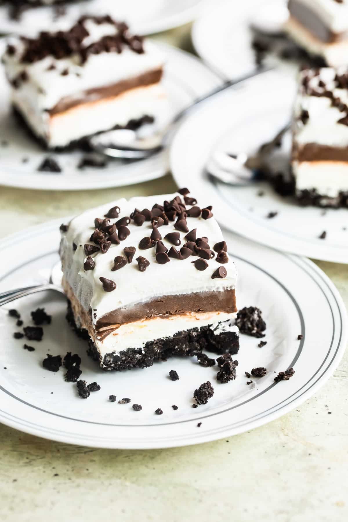 A chocolate lasagna slice on a white plate.
