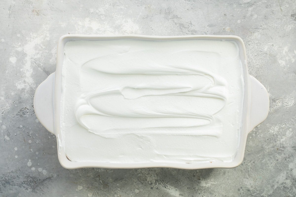 Chocolate lasagna in a white baking dish.