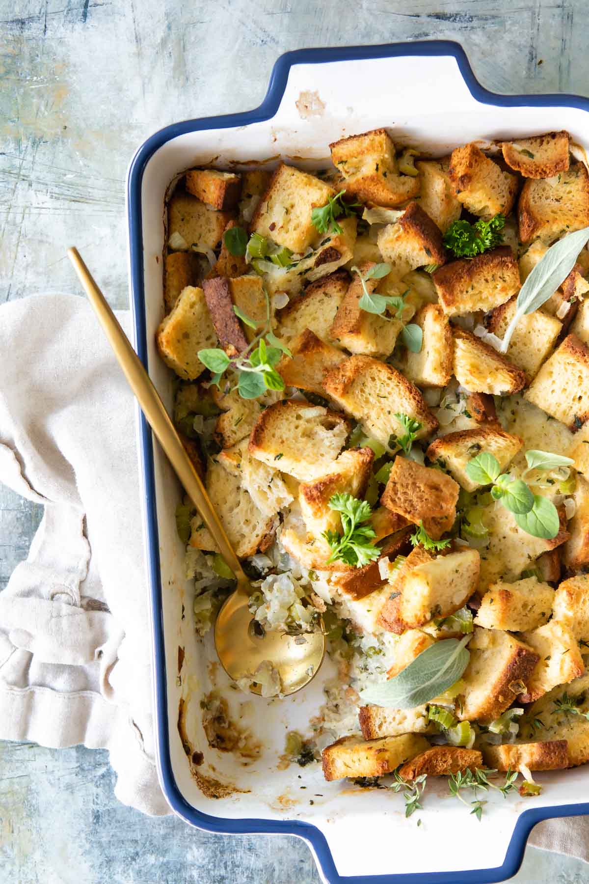A baking dish full of gluten free stuffing.