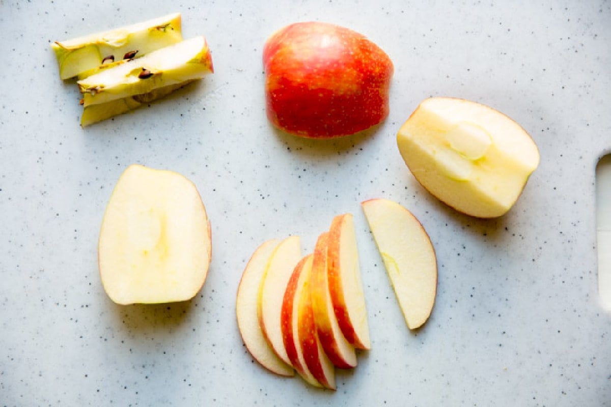 Apple slices on a cutting board.