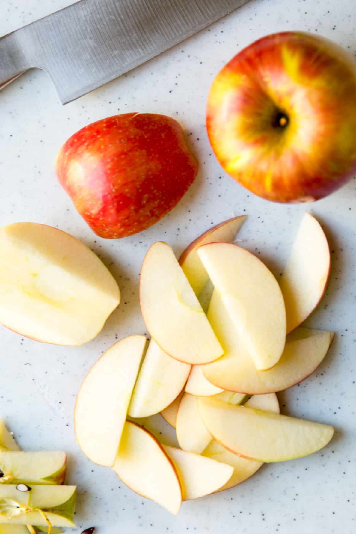 Apple slices on a cutting board.