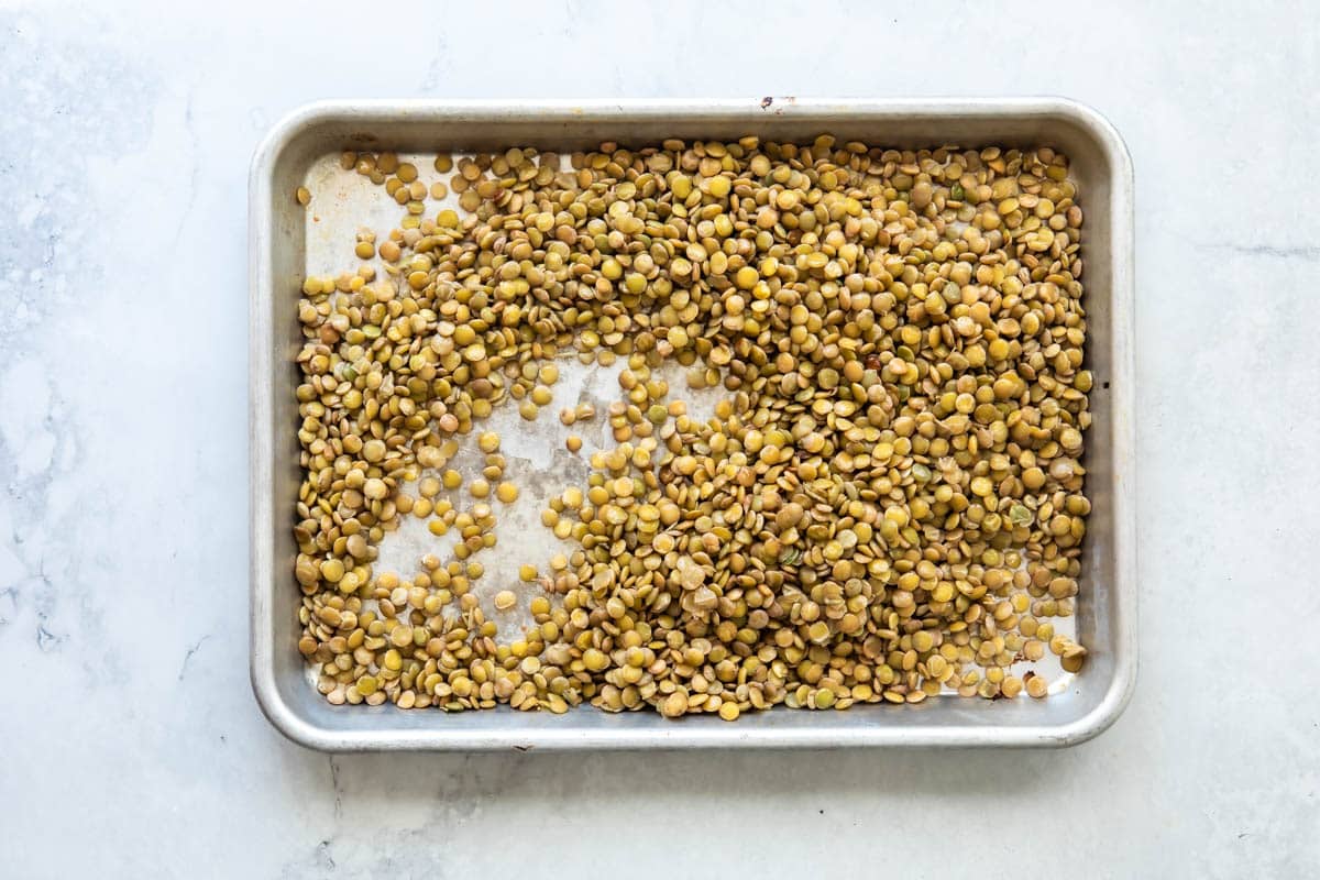 Lentils on a baking sheet.