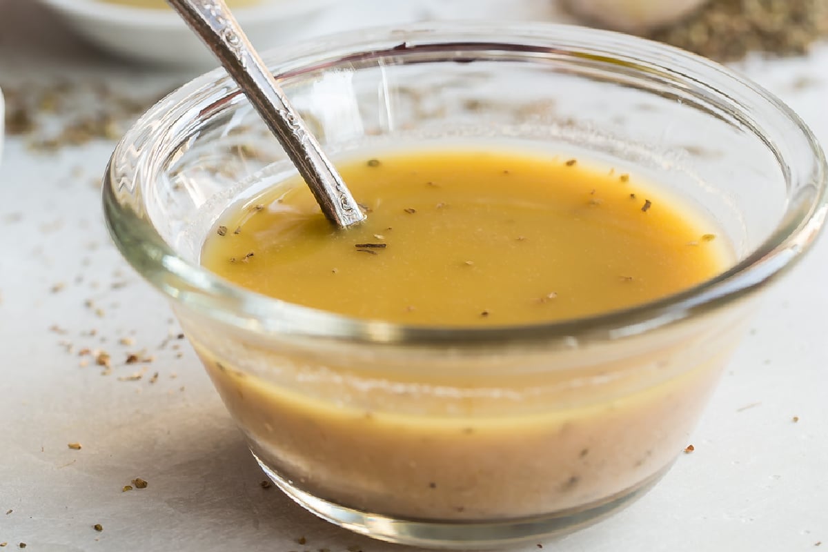 A bowl of red wine vinaigrette.