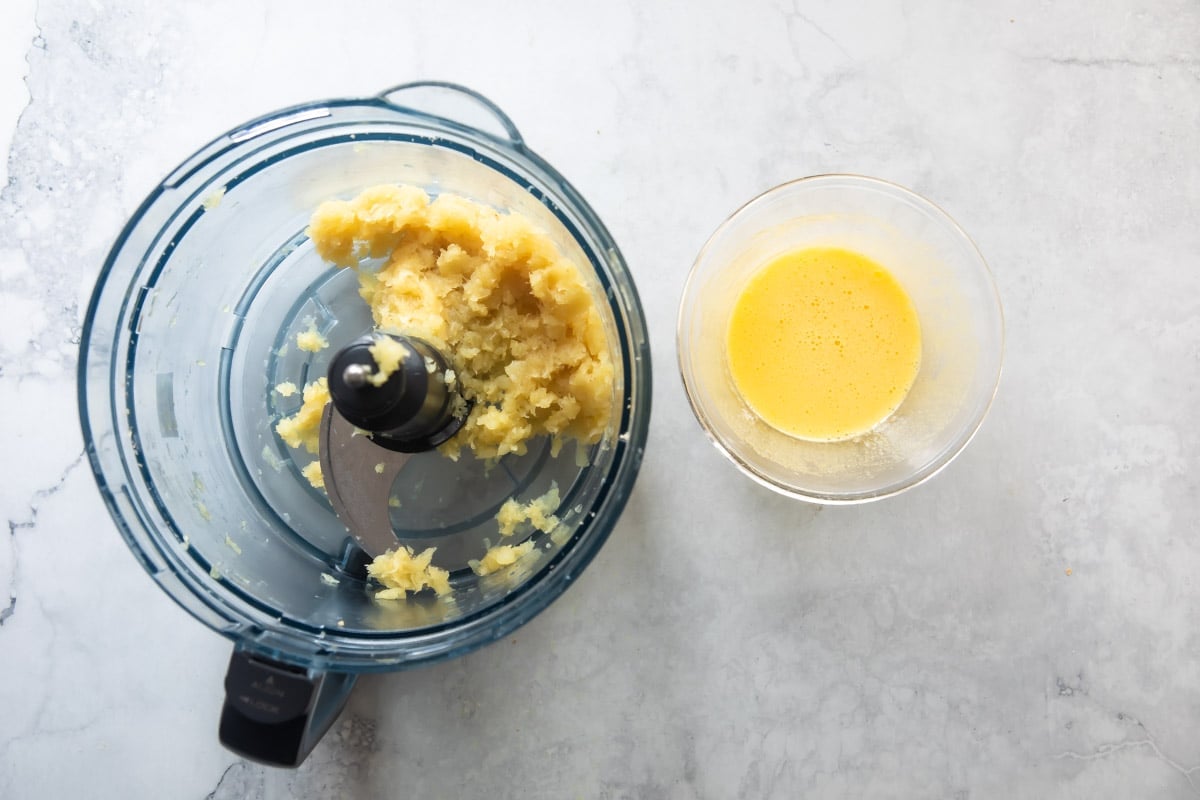 Blending pineapple in a food processor.