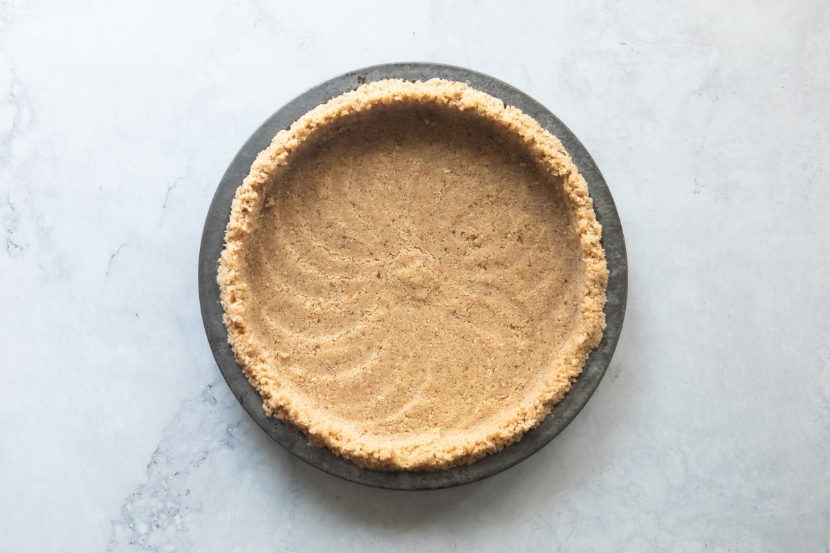 A pecan crust before baking.