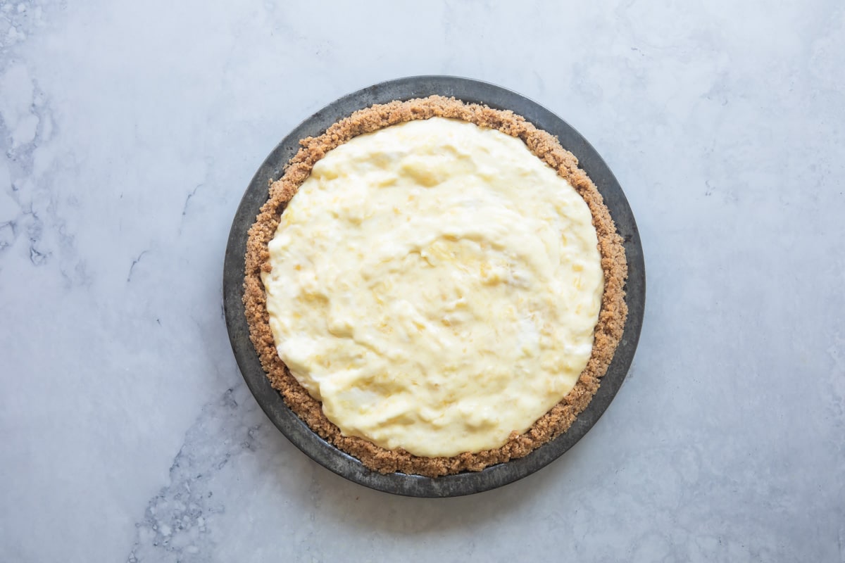 A baked pecan crust filled with pineapple filling.