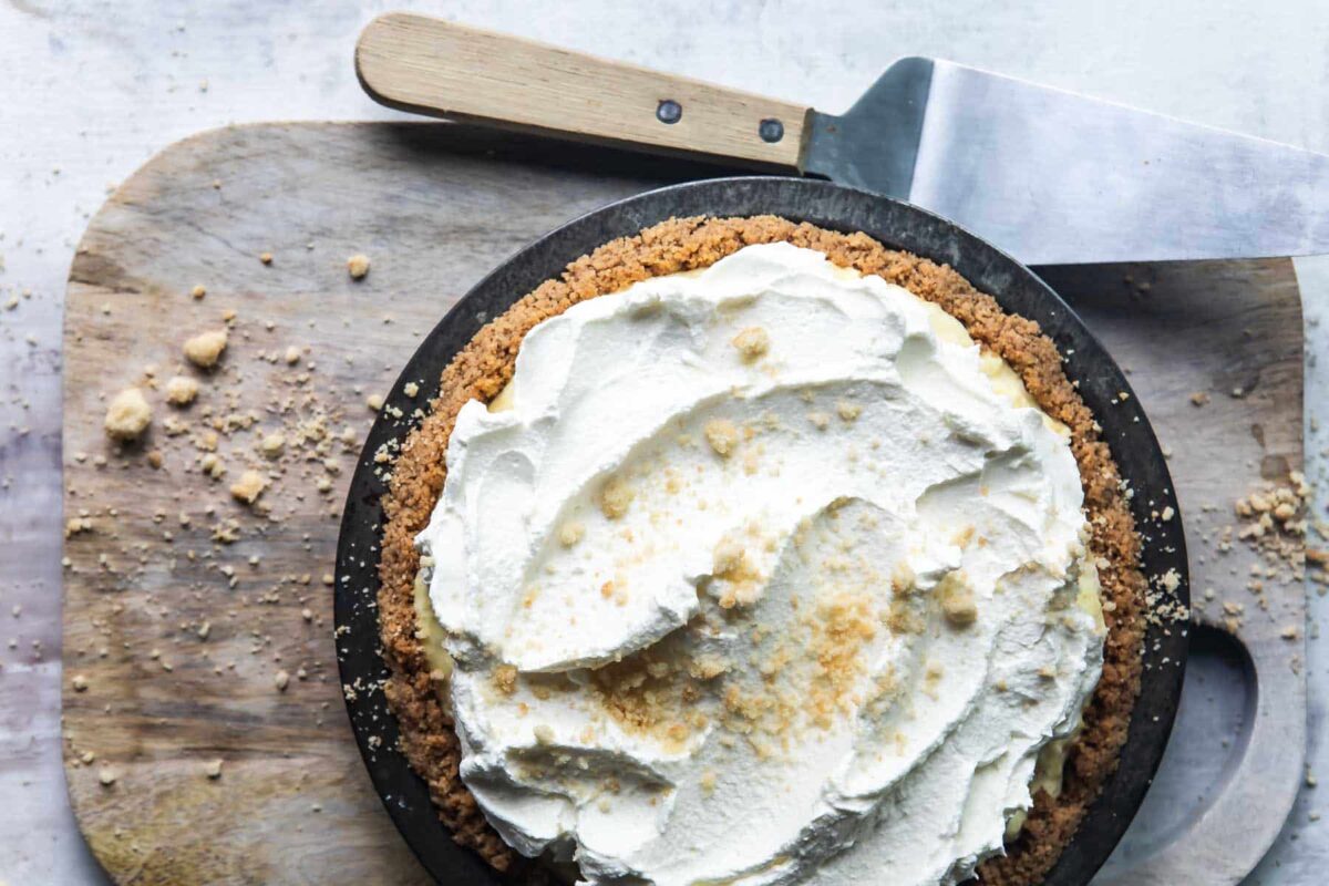 A millionaire pie on a wooden cutting board.