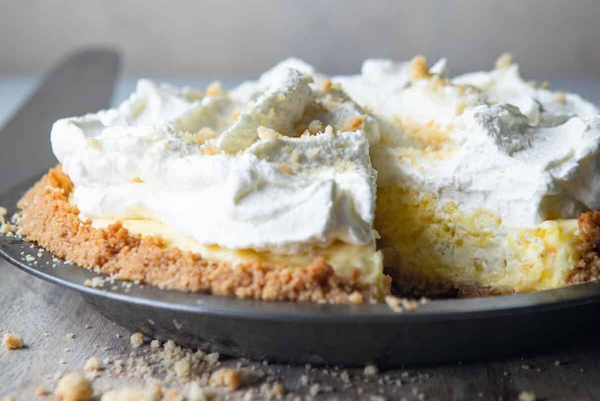 A millionaire pie on a wooden cutting board.