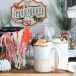 Two cups of hot chocolate at a hot cocoa bar.