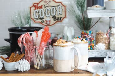 Two cups of hot chocolate at a hot cocoa bar.