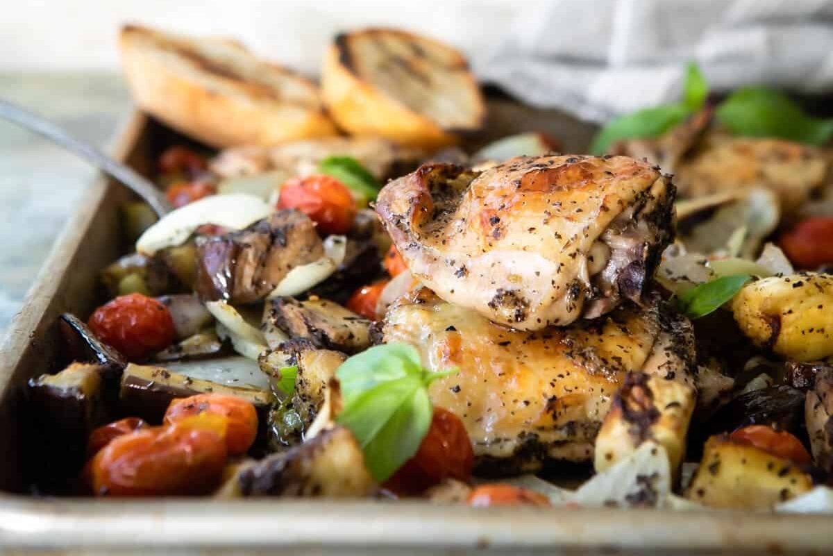 Italian-flavored roasted chicken on a sheet pan with veggies.