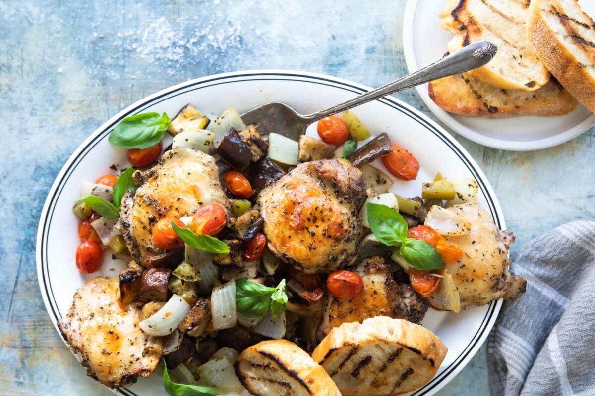 Italian-flavored roasted chicken on a sheet pan with veggies.