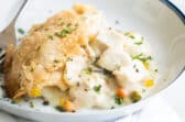 Chicken pot pie in a white dish.