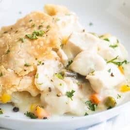 Chicken pot pie in a white dish.