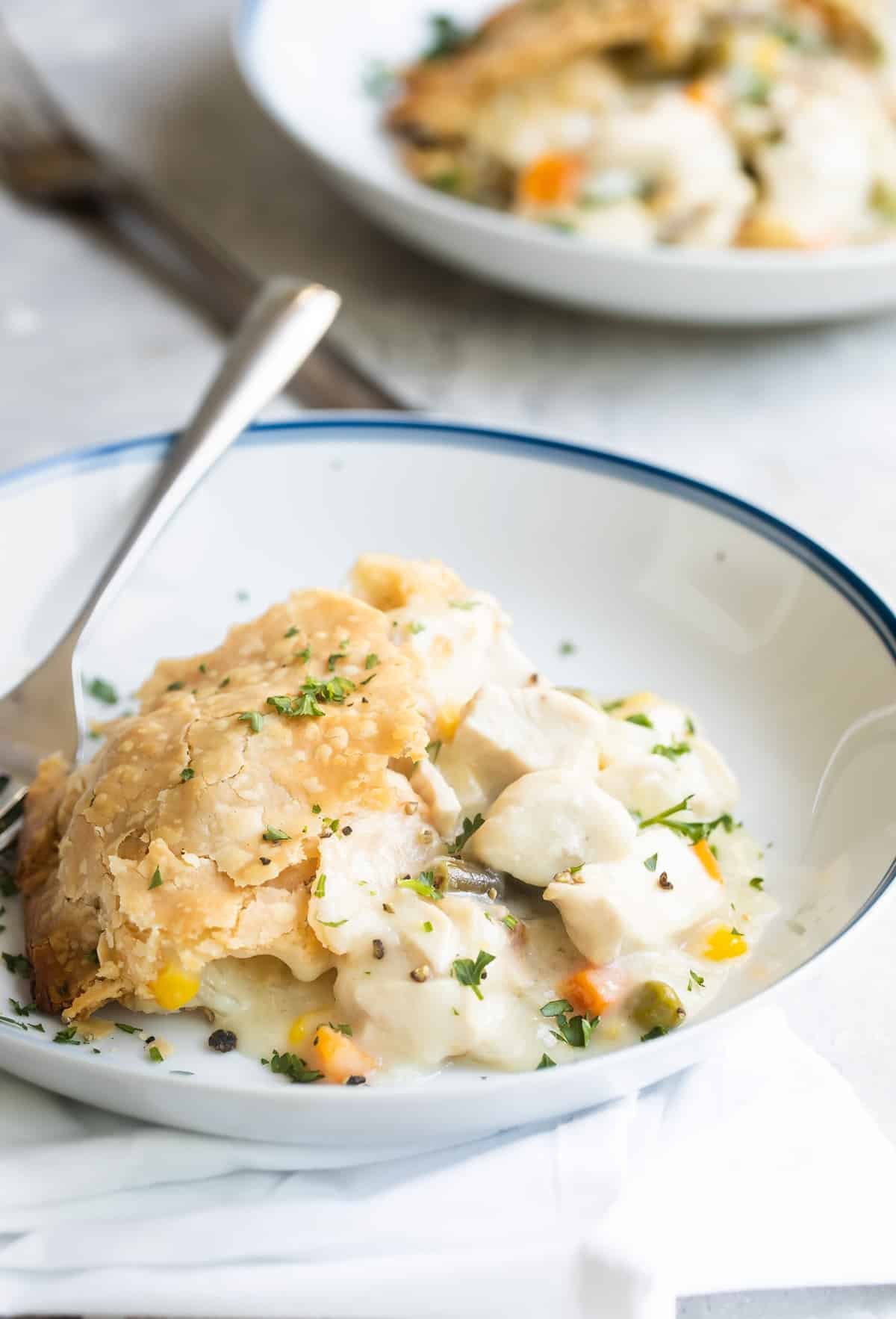 Chicken pot pie in a white dish.