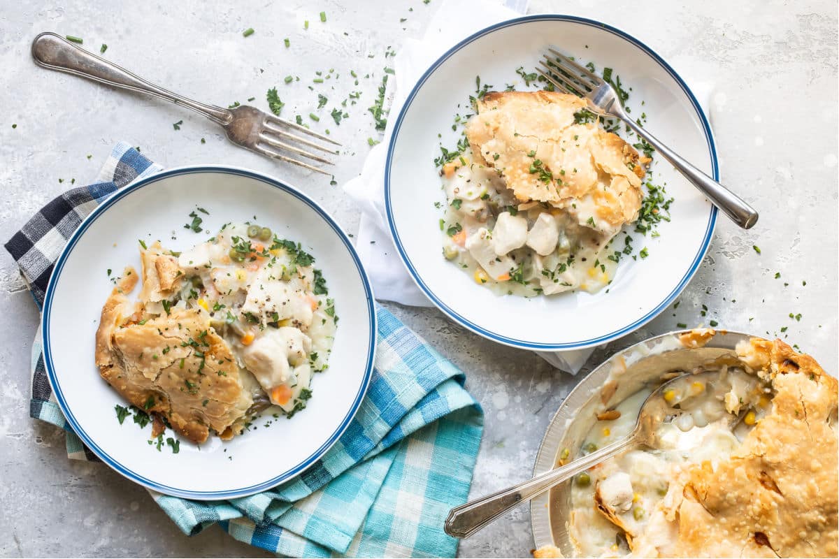 Chicken pot pie in white dishes.