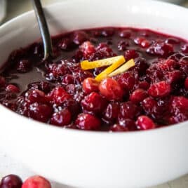 Cranberry sauce in a white bowl.