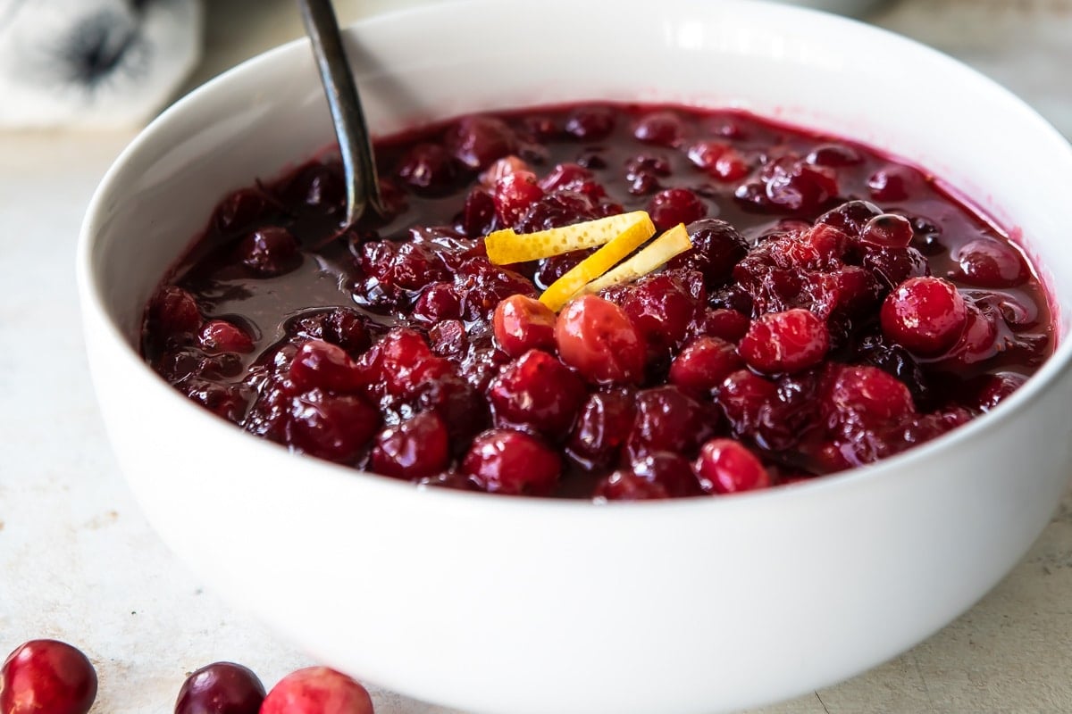Cranberry sauce in a white bowl.