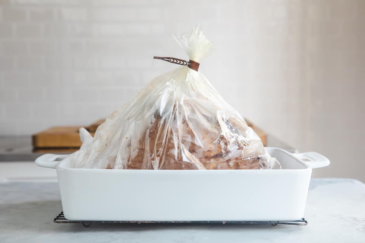 A smoked ham in an oven bag.