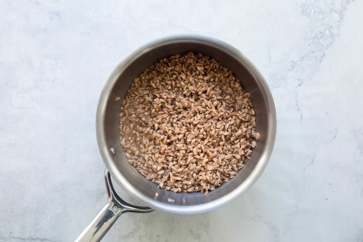 Cooking farro in a saucepan.