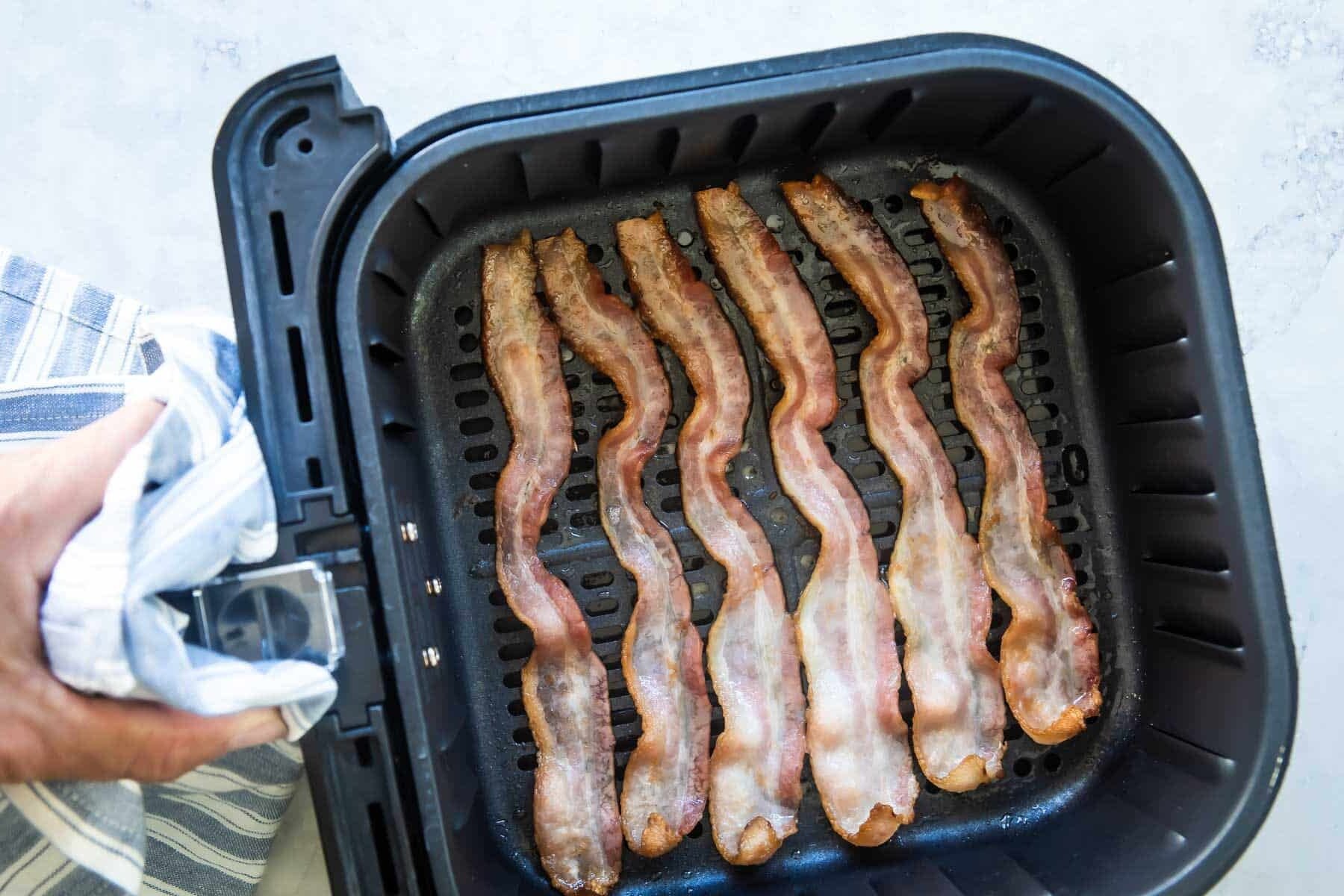 Cooking bacon in an air fryer.