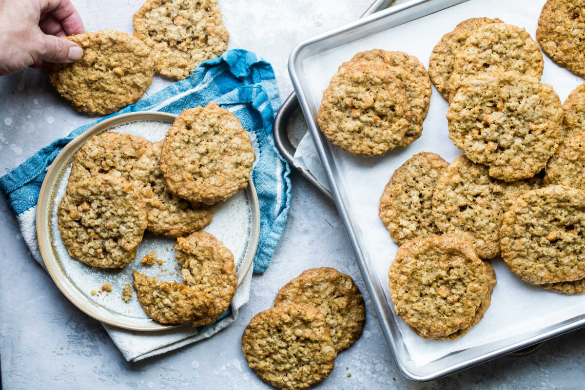Someone holding a pan of oatmeal scotchies.