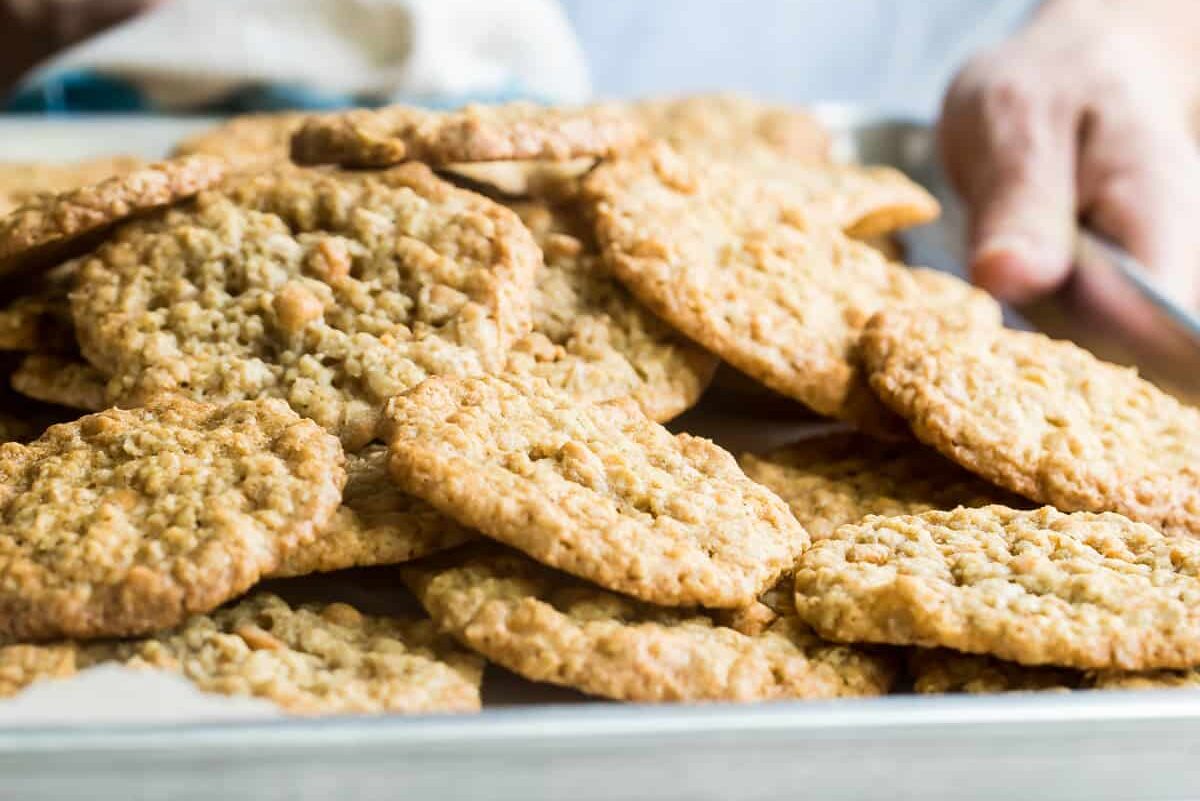 Someone holding a pan of oatmeal scotchies.