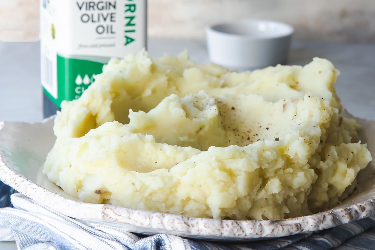 A serving dish filled with vegan mashed potatoes.