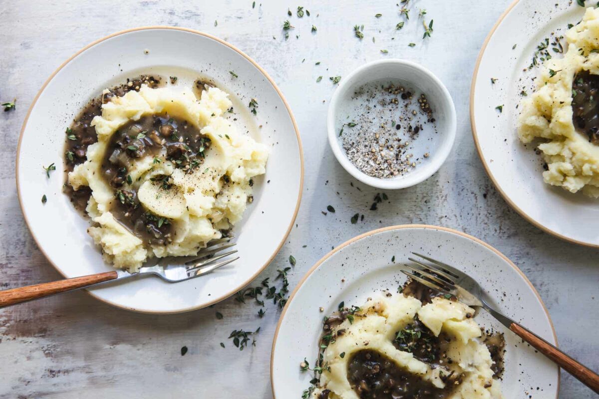 Vegan mashed potatoes with vegan mushroom gravy.