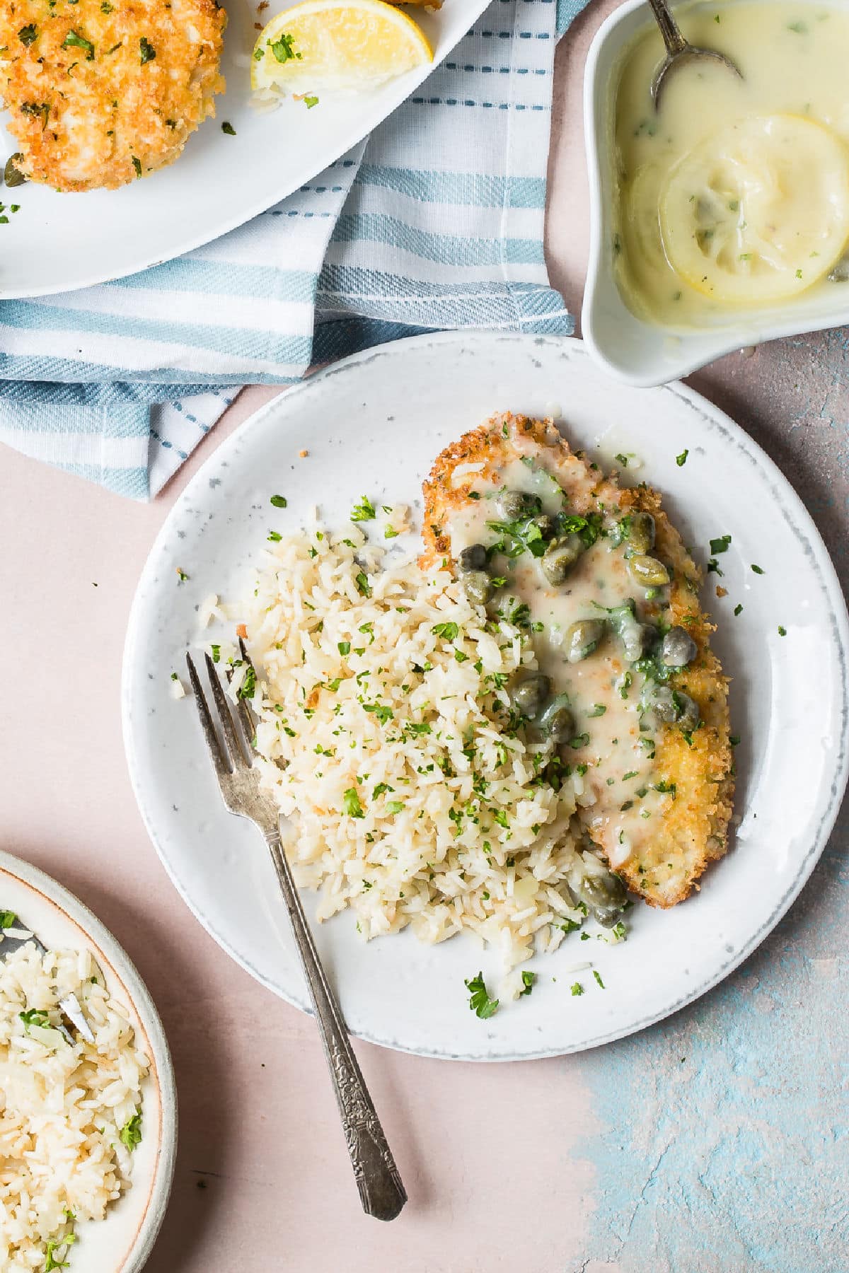 Plates of Chicken Piccata with Lemon Rice Pilaf.