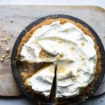 A millionaire pie on a wooden cutting board.