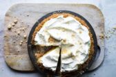 A millionaire pie on a wooden cutting board.