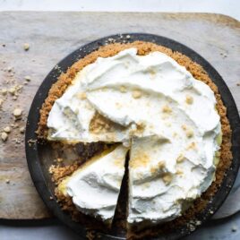 A millionaire pie on a wooden cutting board.