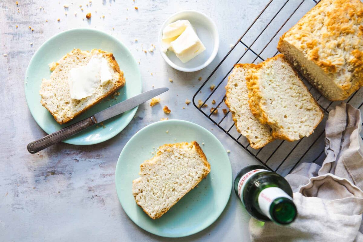 A slice of beer bread with butter on top.