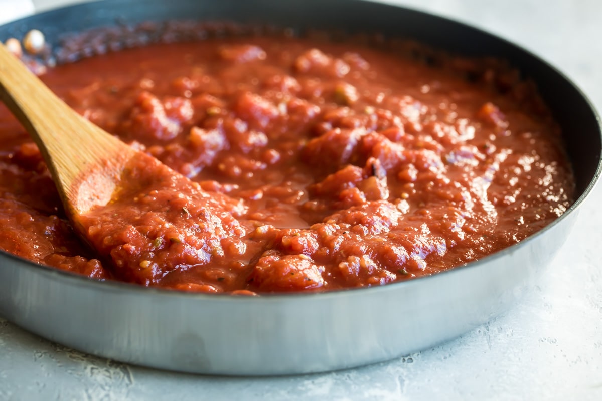 A saucepan of marinara sauce.