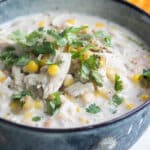 Slow cooker white chicken chili in a blue bowl.