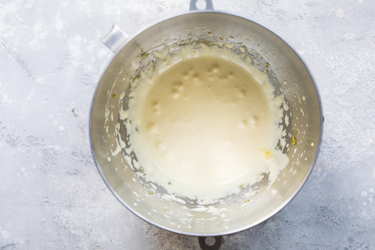 Flourless chocolate cake batter in a silver bowl.
