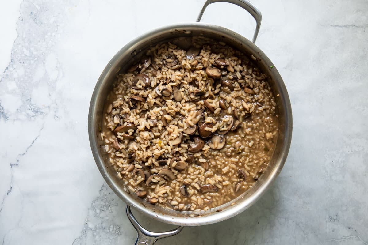 A skillet full of mushroom risotto.