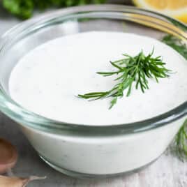 Ranch Dressing in a clear glass dish on a countertop.